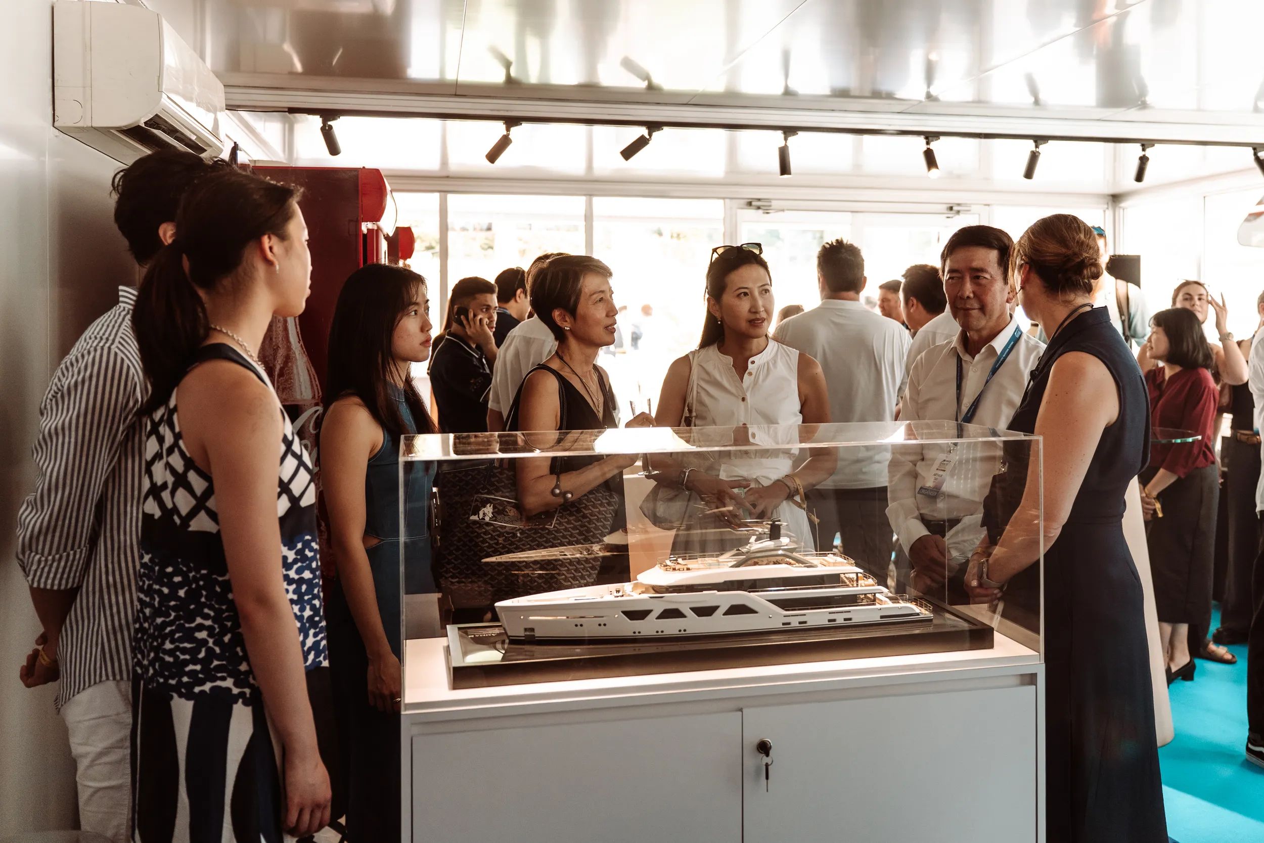 Sarah Flavell at the Singapore yachting festival with a scale model 2025
